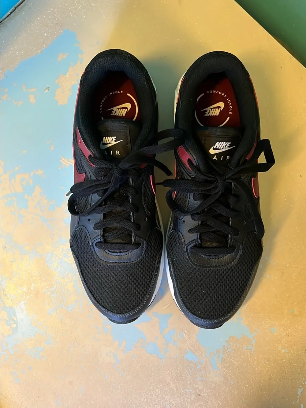 Nike Black Sneakers with Burgundy Swoosh and White Midsole